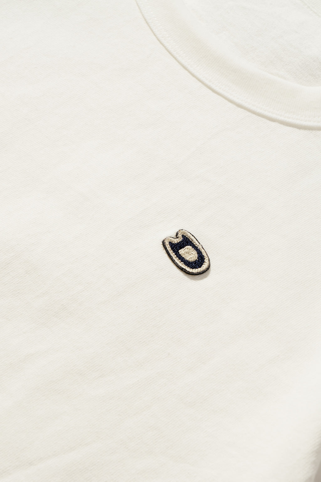 S/S U.S. Parkdale Natural White Jersey w/Dino Small Patch