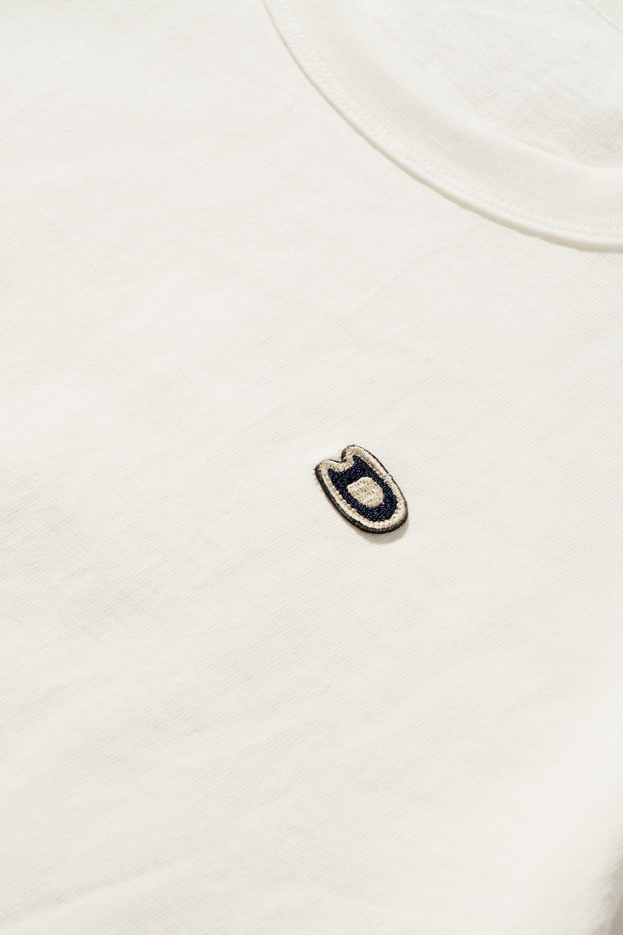 S/S U.S. Parkdale Natural White Jersey w/Dino Small Patch
