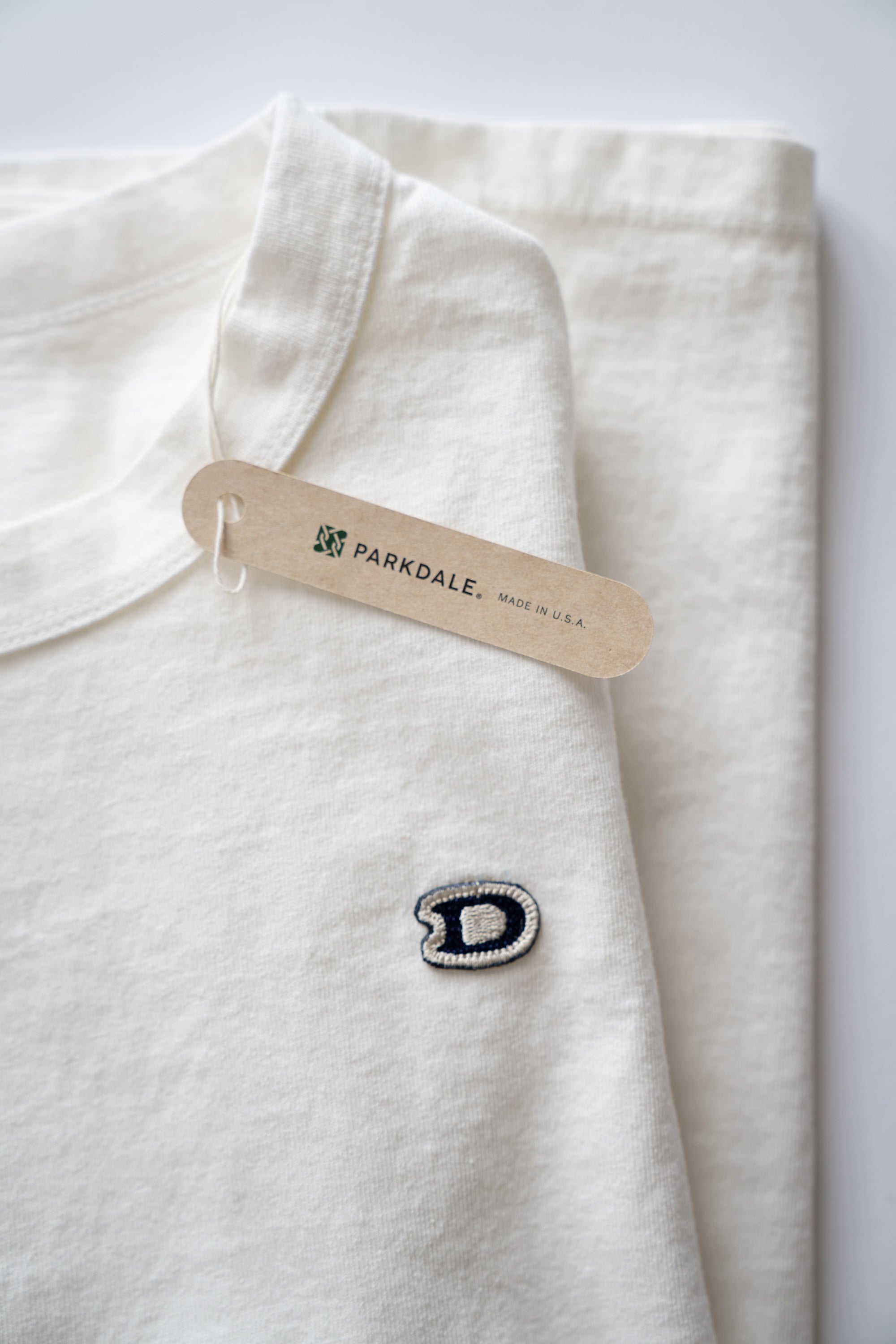 S/S U.S. Parkdale Natural White Jersey w/Dino Small Patch