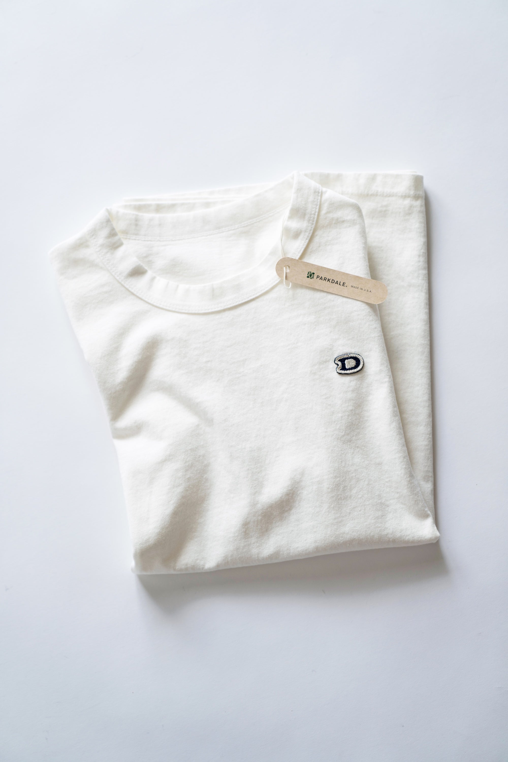 S/S U.S. Parkdale Natural White Jersey w/Dino Small Patch